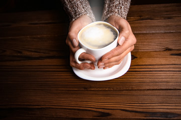 female hands and coffee