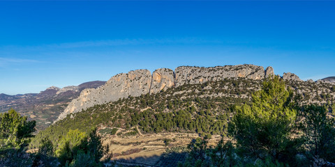 Fototapeta na wymiar Panoramic view of Via Ferrata Rocher du Saint-Julien surrounded by mountains in southeastern France