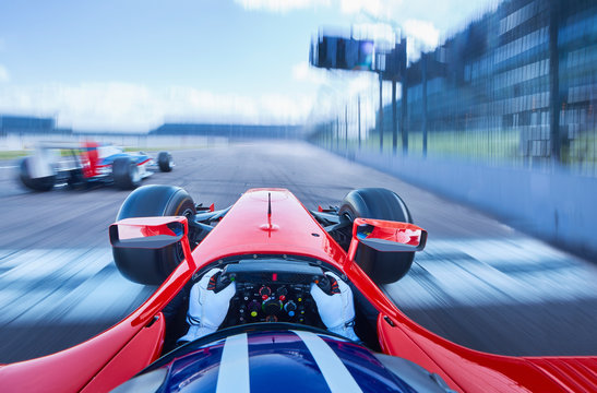 Personal perspective formula one race car driver speeding on race track