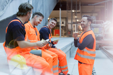 Construction workers eating lunch at construction site