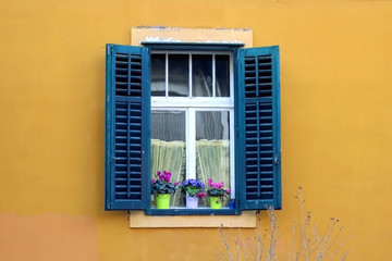 Traditional Mediterranean window with wooden shutters in Split, Croatia. Traditional colorful...
