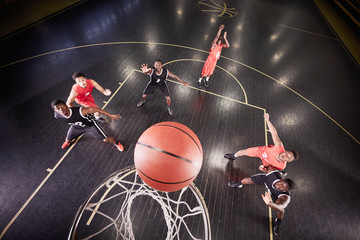 Overhead view young male basketball player shooting free throw in basketball game