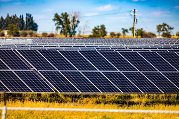 A wide view of photovoltaic, PV, solar panels at a renewable energy farm in rural Saskatchewan,...