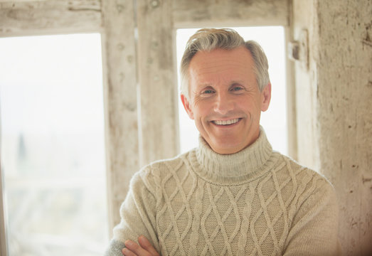 Portrait Smiling Senior Man In Turtleneck Sweater