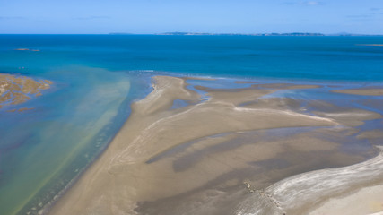 Aerial View from the Beach, Ocean, Green Trees of Wenderholm Regional Park in New Zealand - Auckland Area