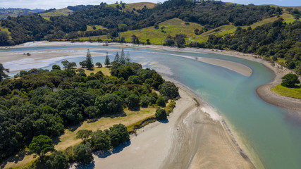 Aerial View from the Beach, Ocean, Green Trees of Wenderholm Regional Park in New Zealand - Auckland Area