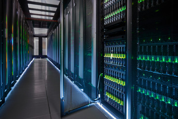 Glowing, open panel in dark server room