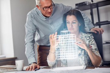Female architect performing telekinesis, hovering futuristic glowing plastic model