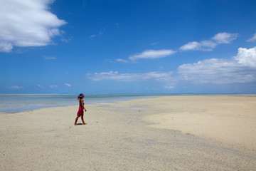 Girl on the beach of Ile aux Benitiers, Mauritius