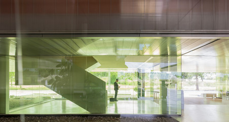 Silhouette businessman in modern office lobby