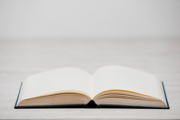 open book on wooden table