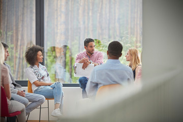People talking in group therapy session