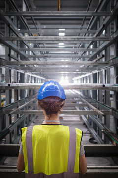 Female worker in steel factory