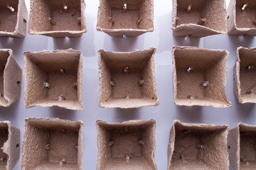 Fibre square biodegradable paper pots. Empty containers, top view.