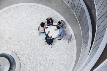View from above architects meeting in atrium courtyard