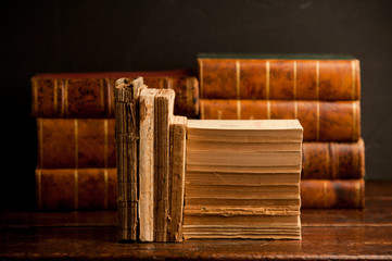 old books on old wooden shelf, with books in the background