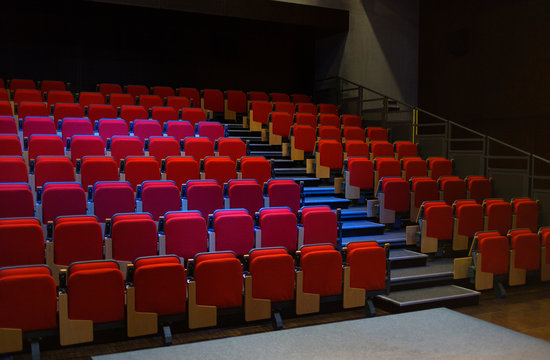 Red seats in empty auditorium