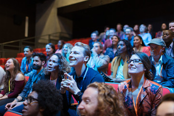 Smiling, attentive man in audience