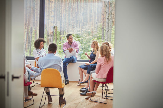 Woman talking in group therapy session