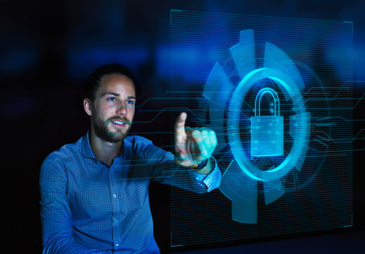 Businessman accessing security feature on futuristic hologram computer - Powered by Adobe