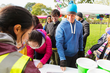 Runners checking in for charity run in park