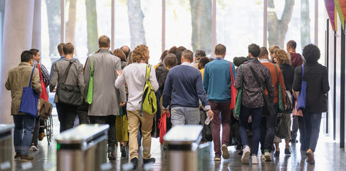 Business people leaving office lobby