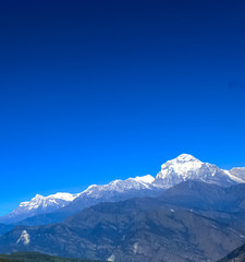 Fototapeta na wymiar Beautiful and Amazing Snow-covered Mountain With Blue Sky