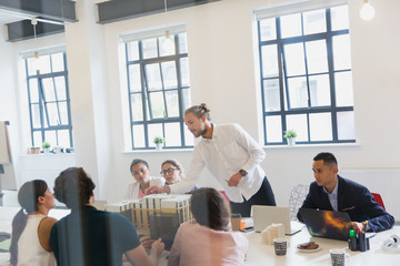Male architect leading conference room meeting