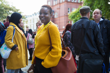 Portrait smiling, confident businesswoman in crowd