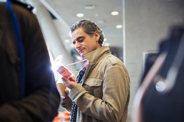 Businessman looking at conference identification pass