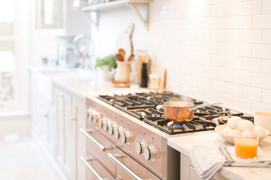 Copper pot on kitchen stove