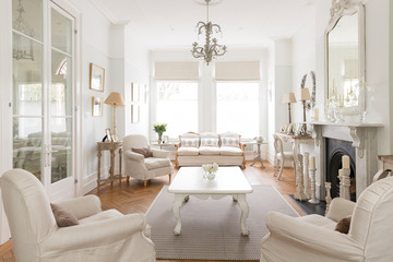 White luxury home showcase interior living room fireplace chandelier