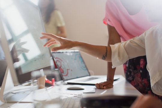 Designers working at computer in office