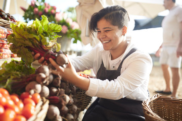 Woman working at farmer‚Äôs market