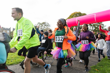 Enthusiastic runners running at charity run in park