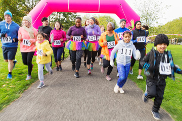 Runners running at charity run in park
