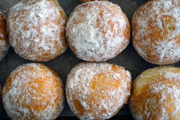 Fried donut fritters with sugar