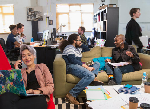 Creative Business People Meeting Working In Casual, Open Plan Office