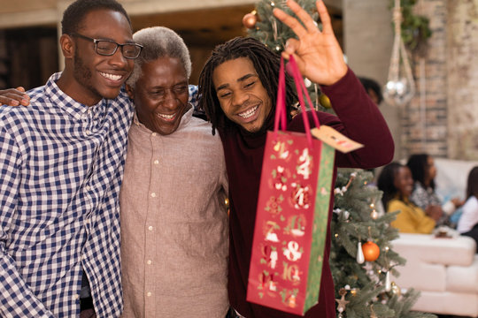 Grandsons surprising grandfather with Christmas gift