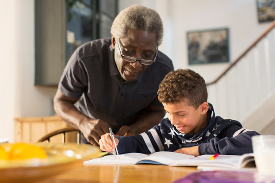 Grandfather helping grandson with geometry homework