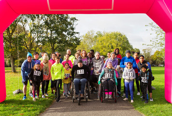 Portrait crowd of runners ready at charity run starting line