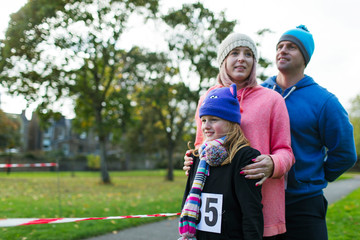 Family runners at charity run in park