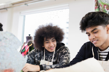 Teenage boys in high school art class