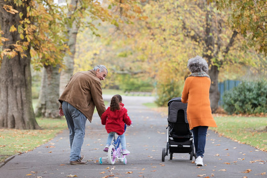 Grandparents with grandchildren in autumn park