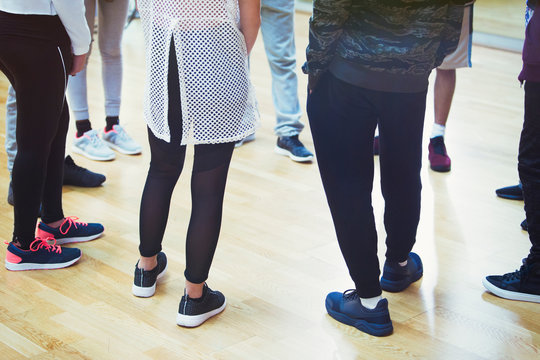 Teenage students standing in circle in dance class studio
