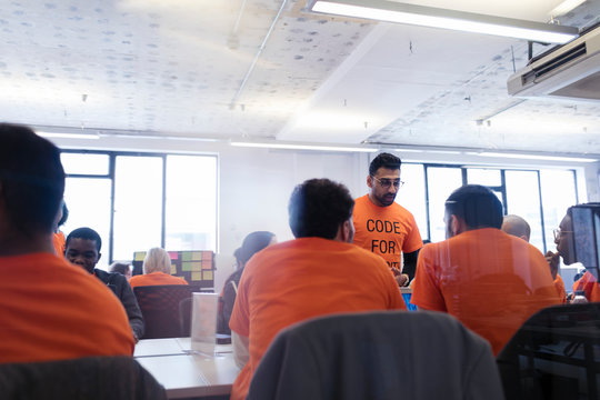 Hackers coding for charity at hackathon