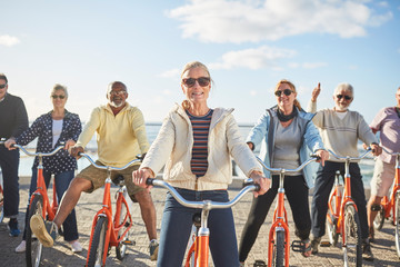 Portrait smiling, confident active senior friend tourists bike riding