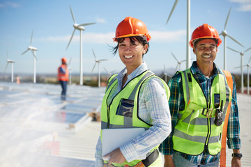 Portrait confident engineers at alternative energy power plant