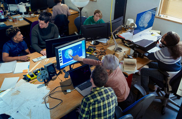 Creative designers working, meeting n open plan office