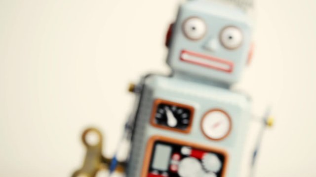 Close-up view of a walking retro wind-up Robot toy